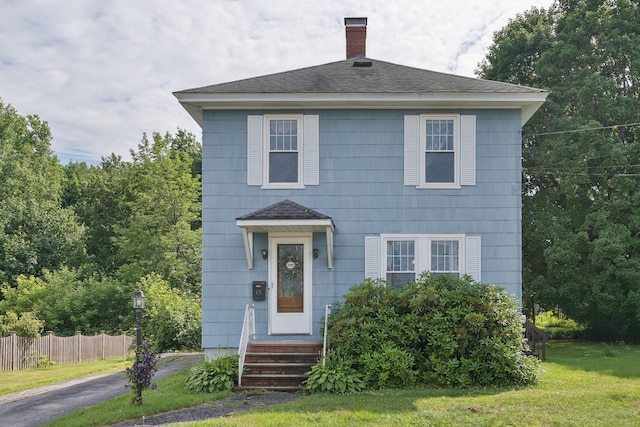 15 Huston Ave, Auburn, ME 04210 - view of front of house featuring a chimney and a shingled roof