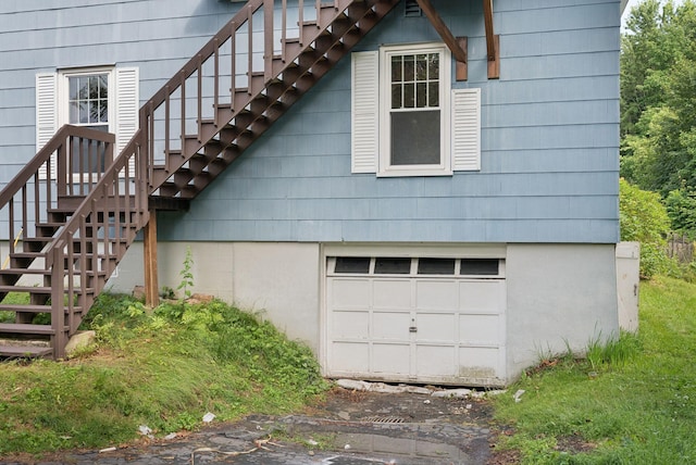 15 Huston Ave, Auburn, ME 04210 - view of home's exterior with stairs and a garage
