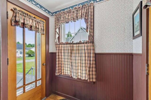 15 Huston Ave, Auburn, ME 04210 - doorway to outside featuring wallpapered walls, a wainscoted wall, and healthy amount of natural light