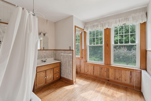 15 Huston Ave, Auburn, ME 04210 - full bath with hardwood / wood-style flooring, vanity, radiator, a wainscoted wall, and a shower with curtain