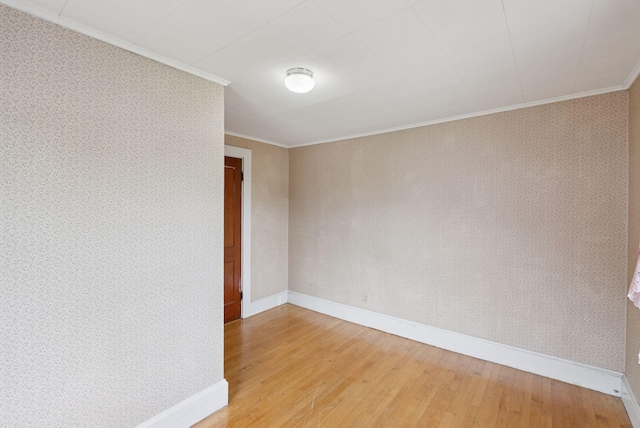 15 Huston Ave, Auburn, ME 04210 - unfurnished room with ornamental molding, light wood-style flooring, and wallpapered walls