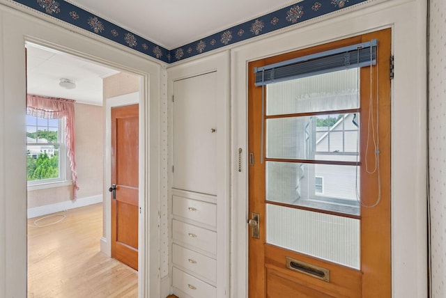 15 Huston Ave, Auburn, ME 04210 - doorway featuring light wood-style floors and baseboards