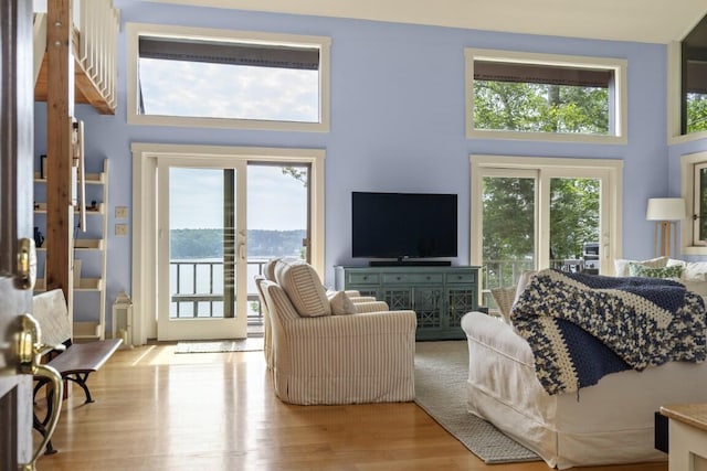 127 Appalachee Rd, Boothbay Harbor, ME 04538 - living room featuring plenty of natural light, a high ceiling, and wood finished floors