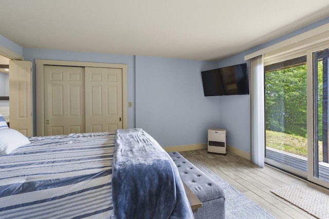 127 Appalachee Rd, Boothbay Harbor, ME 04538 - bedroom with wood-type flooring, a closet, and access to outside