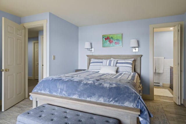 127 Appalachee Rd, Boothbay Harbor, ME 04538 - bedroom with a baseboard radiator, wood finished floors, and ensuite bathroom