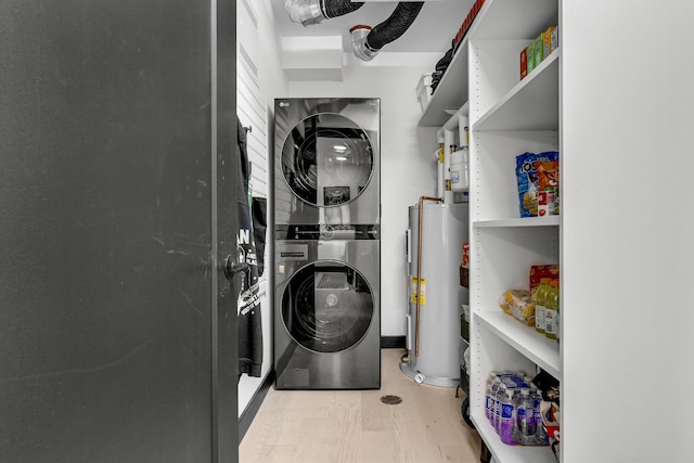 218 Washington Ave Unit 408, Portland, ME 04101 - washroom featuring estacked washer and dryer and gas water heater
