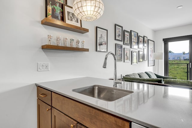 218 Washington Ave Unit 408, Portland, ME 04101 - kitchen with open shelves, open floor plan, brown cabinetry, and light countertops