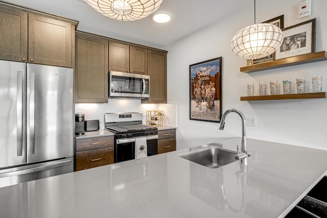 218 Washington Ave Unit 408, Portland, ME 04101 - kitchen with stainless steel appliances, open shelves, light countertops, and pendant lighting
