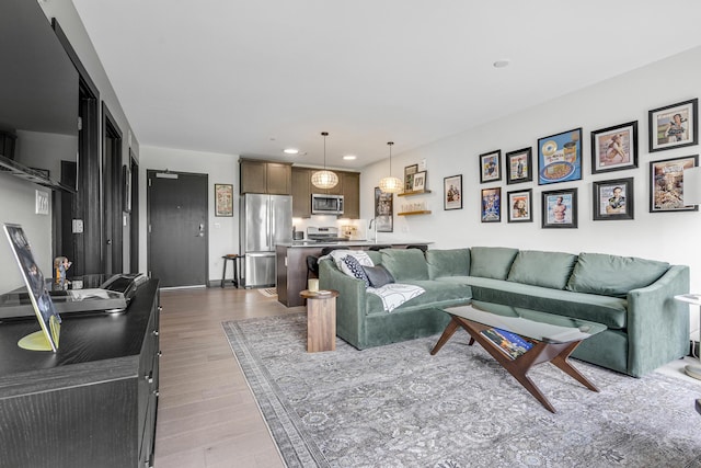 218 Washington Ave Unit 408, Portland, ME 04101 - living room with wood finished floors and recessed lighting