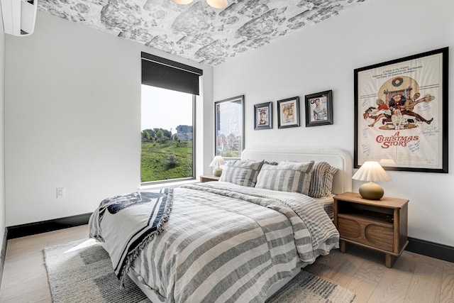 218 Washington Ave Unit 408, Portland, ME 04101 - bedroom featuring wood finished floors and baseboards