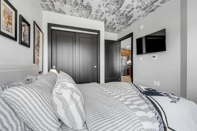 218 Washington Ave Unit 408, Portland, ME 04101 - bedroom with freestanding refrigerator and a closet