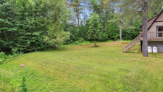 36 Palmer Rd, Etna, ME 04434 - view of grassy yard featuring stairway and a deck