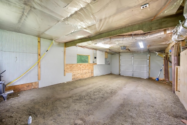 36 Palmer Rd, Etna, ME 04434 - garage featuring a garage door opener
