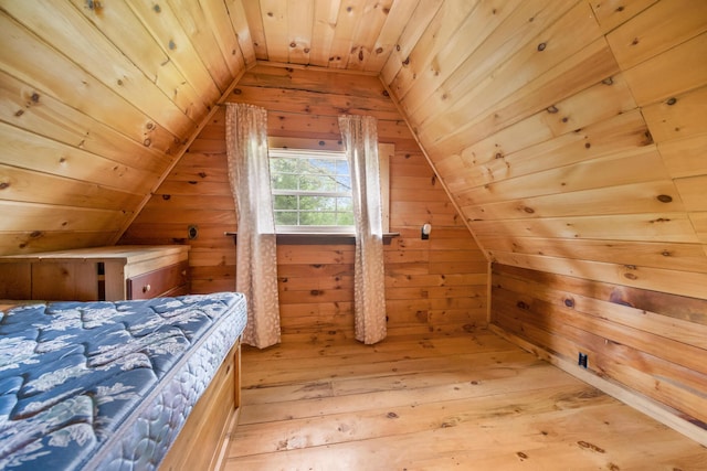 36 Palmer Rd, Etna, ME 04434 - bedroom featuring vaulted ceiling, wood walls, light wood-style flooring, and wood ceiling