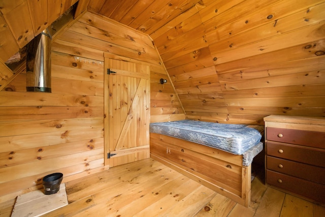 36 Palmer Rd, Etna, ME 04434 - bedroom featuring a sauna / steam room, wood ceiling, wooden walls, light wood finished floors, and lofted ceiling