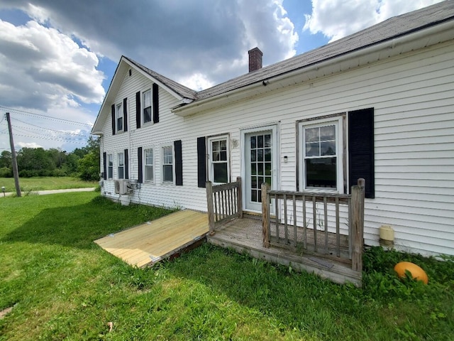 523 Exeter Rd, Corinth, ME 04427 - back of house featuring a lawn and a chimney
