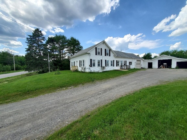 523 Exeter Rd, Corinth, ME 04427 - view of front of property with driveway, a front lawn, and an outbuilding