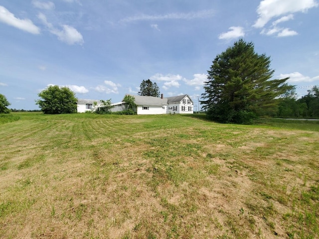 523 Exeter Rd, Corinth, ME 04427 - view of green lawn with a garage