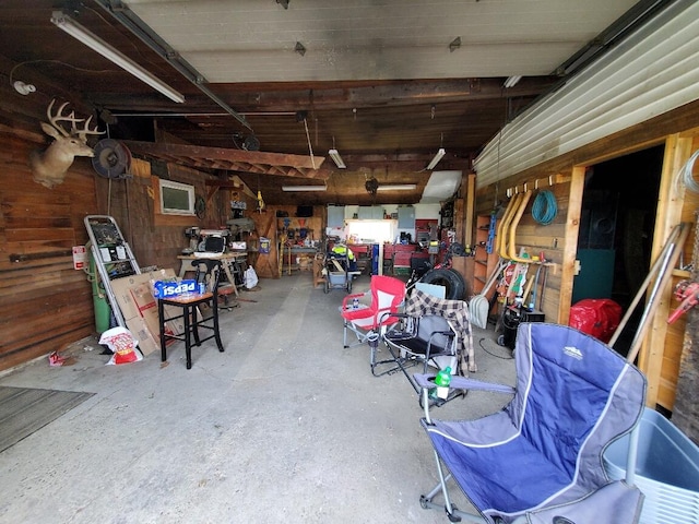 523 Exeter Rd, Corinth, ME 04427 - garage with wood walls and a workshop area
