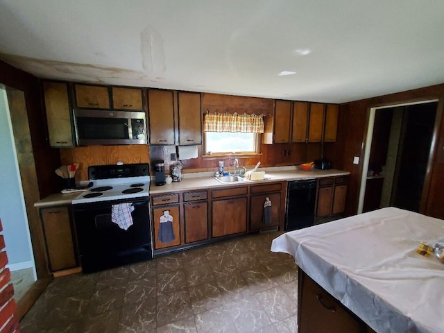 523 Exeter Rd, Corinth, ME 04427 - kitchen featuring black appliances, light countertops, and brown cabinets