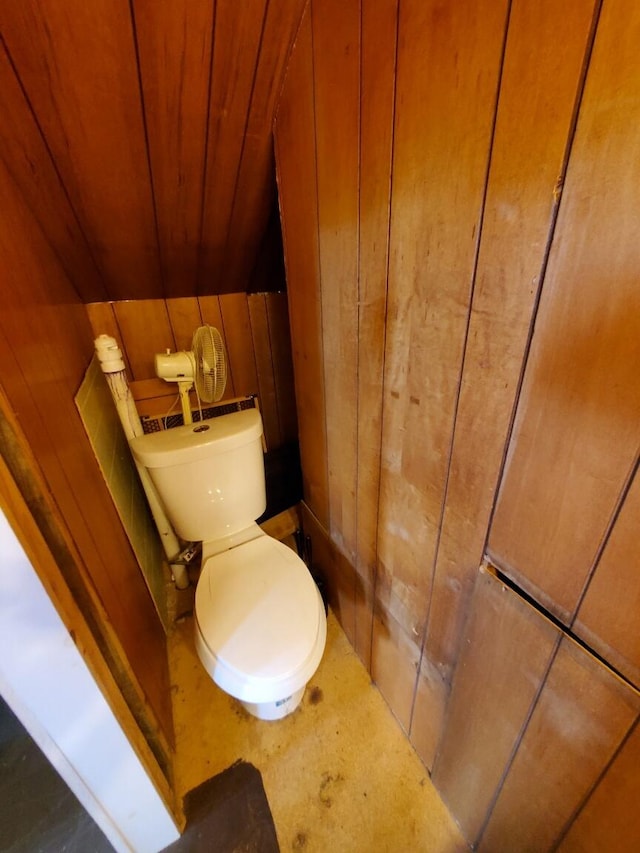 523 Exeter Rd, Corinth, ME 04427 - bathroom with wood walls and toilet