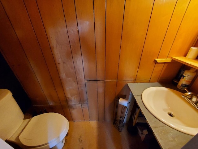 523 Exeter Rd, Corinth, ME 04427 - bathroom with wooden walls and vanity