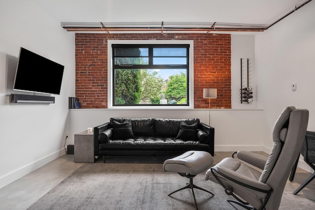 273 Congress St Unit 1, Portland, ME 04101 - living room with finished concrete floors and baseboards