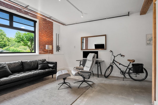 273 Congress St Unit 1, Portland, ME 04101 - living area featuring concrete flooring and rail lighting