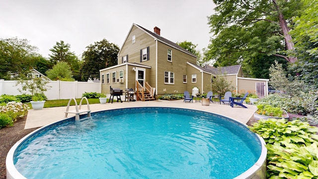11 Southern Ave, Augusta, ME 04330 - outdoor pool with a patio area, entry steps, and view of scattered trees