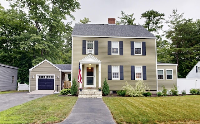 11 Southern Ave, Augusta, ME 04330 - colonial home with a chimney, asphalt driveway, and a shingled roof