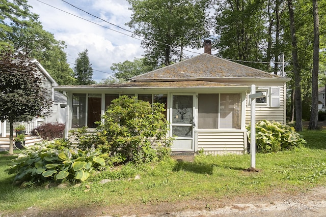 9 Sarah Ln, Standish, ME 04084 - bungalow-style house with a sunroom and a chimney