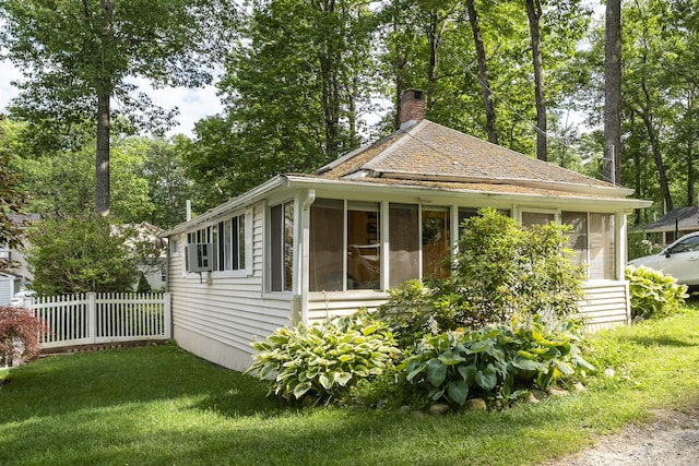 9 Sarah Ln, Standish, ME 04084 - view of property exterior featuring a sunroom and a chimney