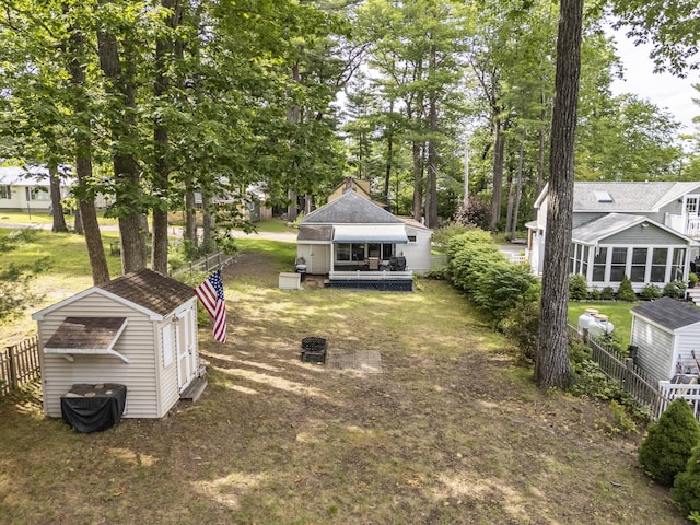 9 Sarah Ln, Standish, ME 04084 - view of yard featuring a storage unit and a sunroom