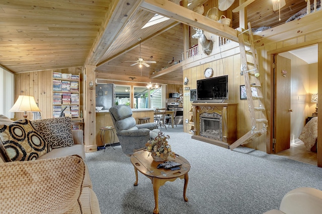 9 Sarah Ln, Standish, ME 04084 - carpeted living area featuring wooden walls, ceiling fan, a glass covered fireplace, and wood ceiling