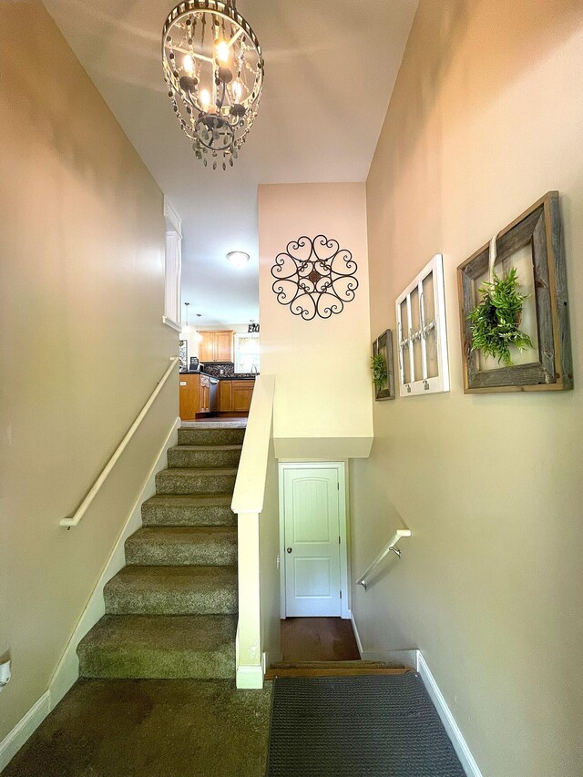 28 Kayla Way, Gorham, ME 04038 - stairs with carpet and a chandelier