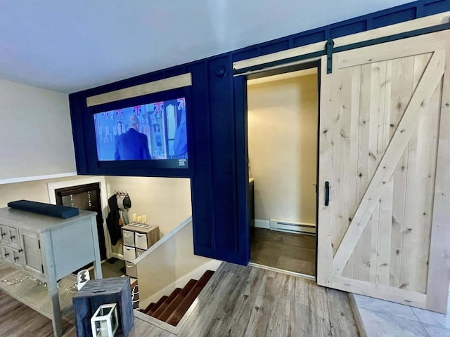 28 Kayla Way, Gorham, ME 04038 - foyer entrance featuring a baseboard heating unit, wood finished floors, and a barn door