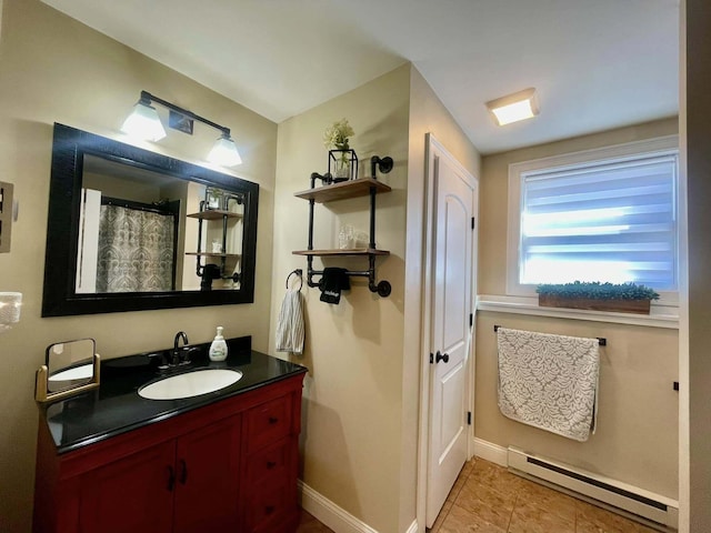 28 Kayla Way, Gorham, ME 04038 - bathroom with a baseboard heating unit, vanity, and tile patterned floors