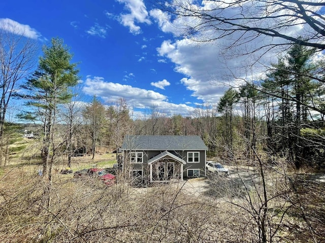 28 Kayla Way, Gorham, ME 04038 - back of property with a forest view and an outbuilding