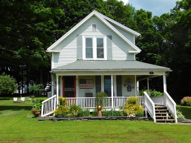 10 Liberty St, Dexter, ME 04930 - farmhouse featuring a porch, a front yard, and roof with shingles