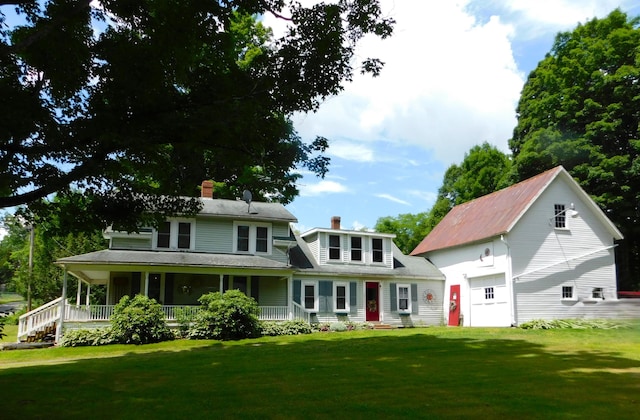 10 Liberty St, Dexter, ME 04930 - view of front of house featuring a chimney, covered porch, and a front yard
