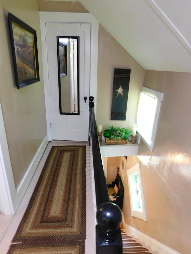 10 Liberty St, Dexter, ME 04930 - corridor featuring lofted ceiling and baseboards