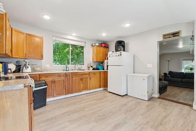 26 Cross St, Westbrook, ME 04092 - kitchen featuring freestanding refrigerator, light wood-style floors, refrigerator, and light countertops