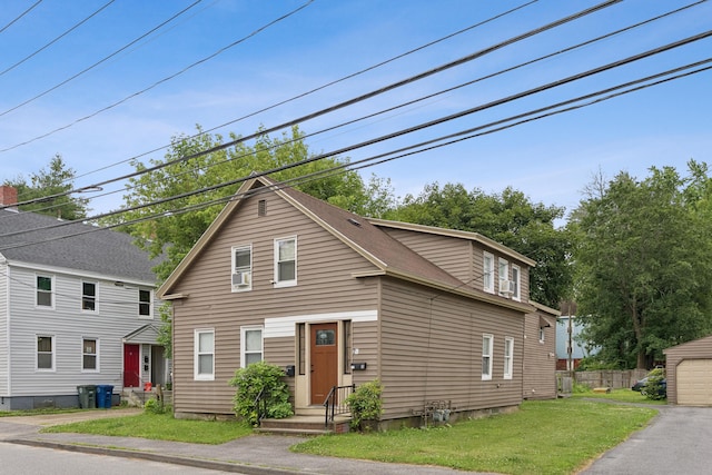 26 Cross St, Westbrook, ME 04092 - view of front facade with an outbuilding and a shingled roof
