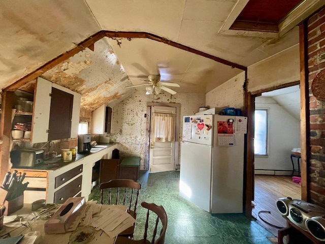 322 Katahdin Ave, Millinocket, ME 04462 - kitchen with freestanding refrigerator, lofted ceiling, a baseboard radiator, and ceiling fan