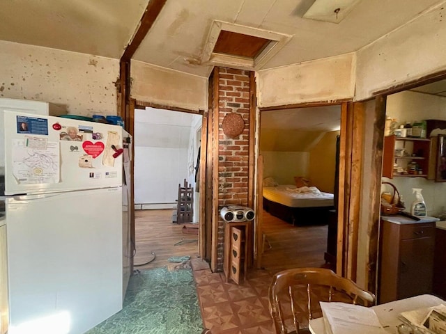 322 Katahdin Ave, Millinocket, ME 04462 - kitchen with freestanding refrigerator and wood finished floors