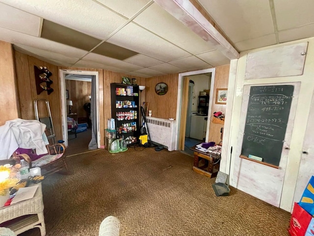 322 Katahdin Ave, Millinocket, ME 04462 - misc room with radiator heating unit, a drop ceiling, carpet floors, and wooden walls