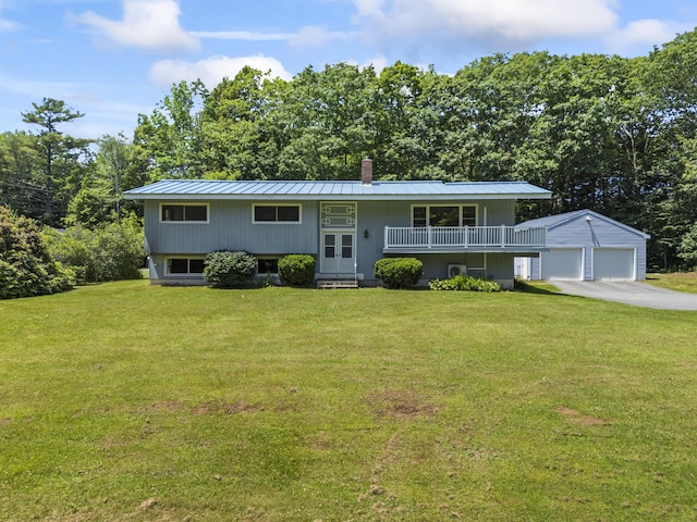 232 Augusta Rd, Topsham, ME 04086 - bi-level home with an outbuilding, a chimney, a front yard, and a metal roof