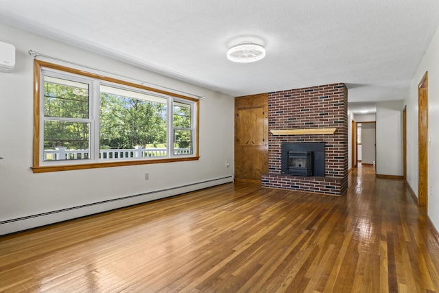 232 Augusta Rd, Topsham, ME 04086 - unfurnished living room with a baseboard radiator and wood-type flooring
