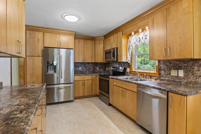 232 Augusta Rd, Topsham, ME 04086 - kitchen with appliances with stainless steel finishes, tasteful backsplash, light tile patterned floors, and dark stone countertops