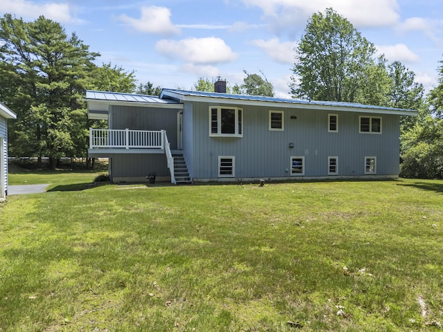 232 Augusta Rd, Topsham, ME 04086 - rear view of house featuring a deck, stairs, a yard, and a chimney